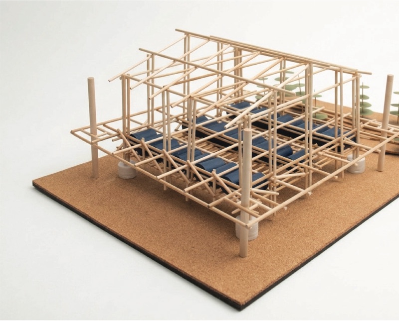 Bamboo stick model of the house frame and raft on a cork base